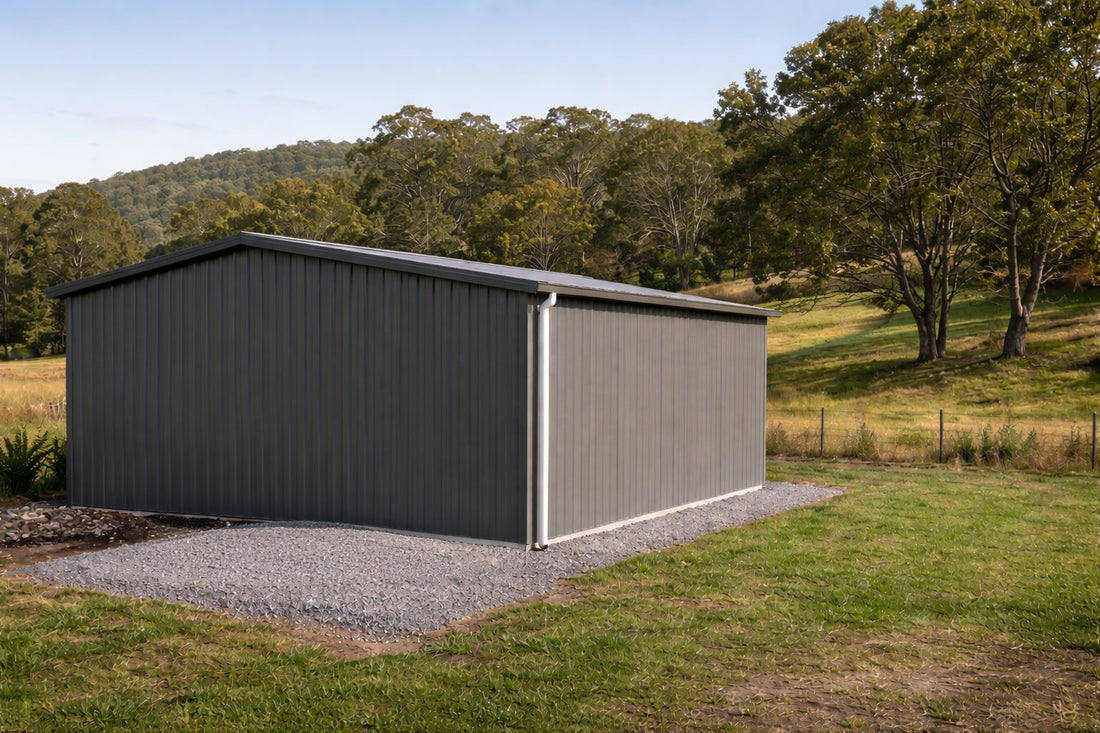 A grey shed with a prepared tank base ready prior to delivery.